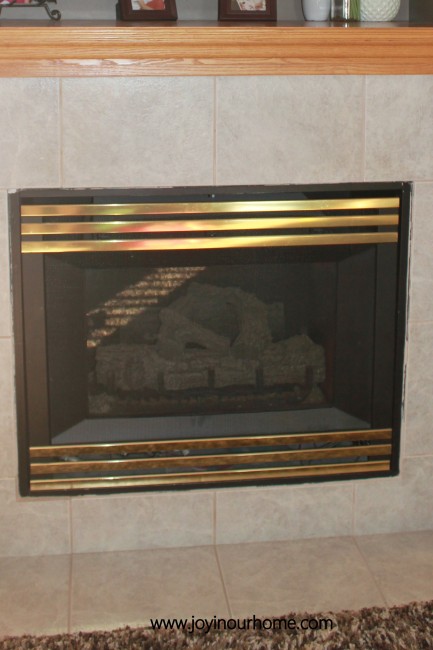 Spray paint fireplace makeover at www.joyinourhome.com