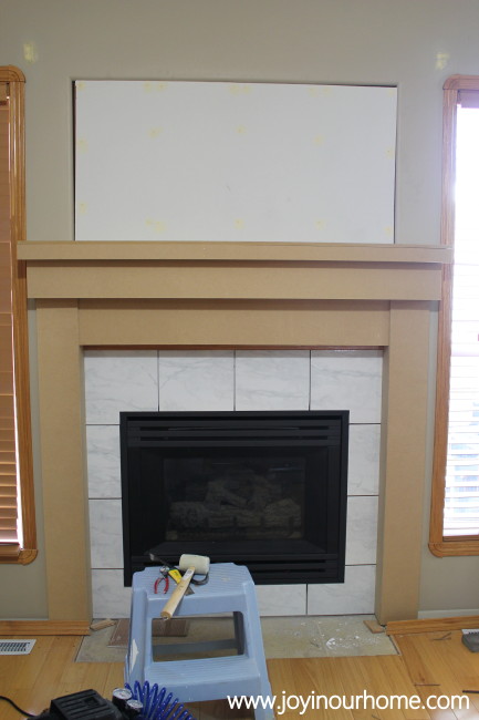 http://www.joyinourhome.com/spray-paint-fireplace-makeover/