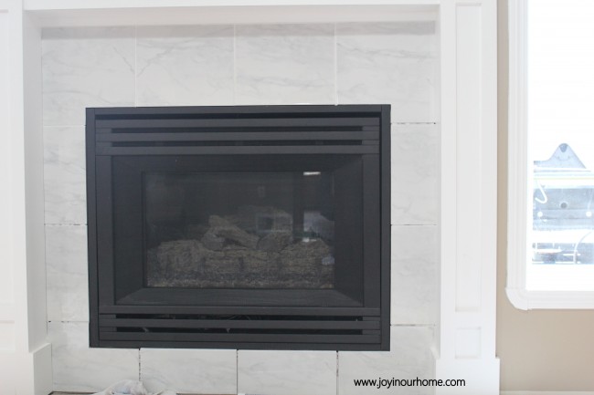 Easy Spray Paint Fireplace Makeover at www.joyinouhome.com