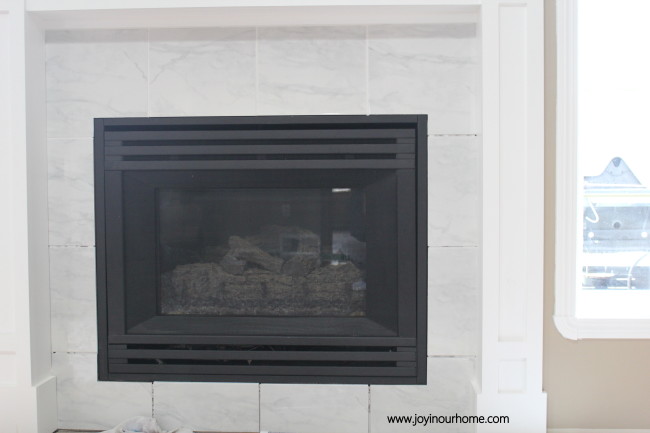 http://www.joyinourhome.com/spray-paint-fireplace-makeover/